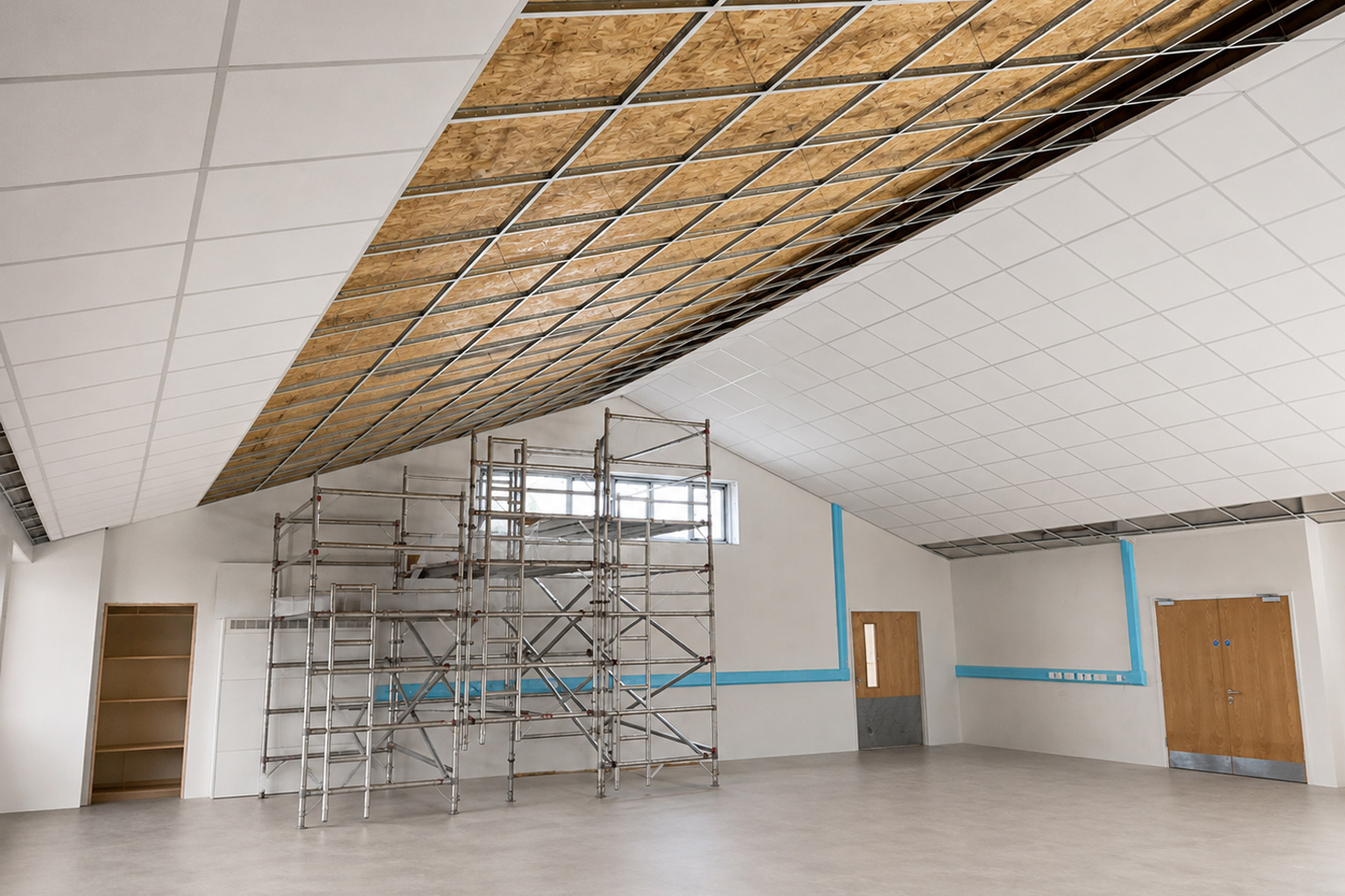 Suspended grid ceiling going in — school hall